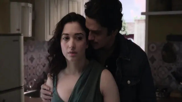 Tamannaah kissing a stranger in a bedroom